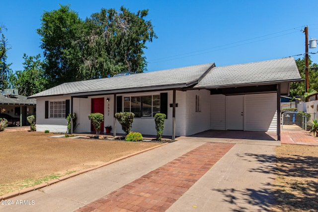 ranch-style house featuring a carport