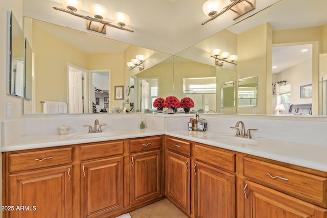 bathroom featuring plenty of natural light, vanity, and tile patterned flooring