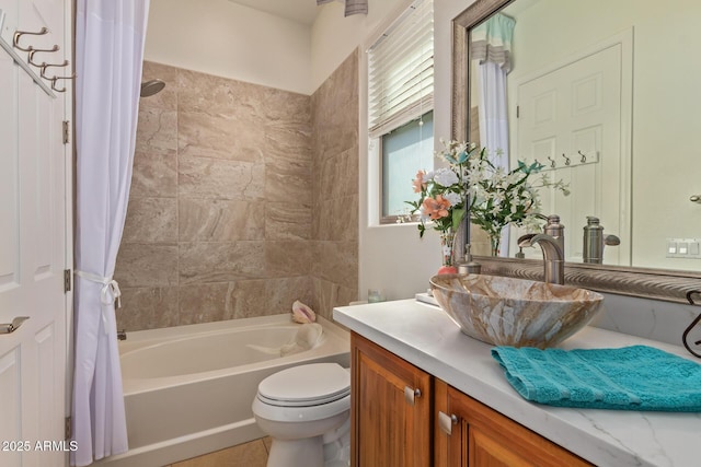 full bathroom featuring toilet, vanity, and shower / tub combo