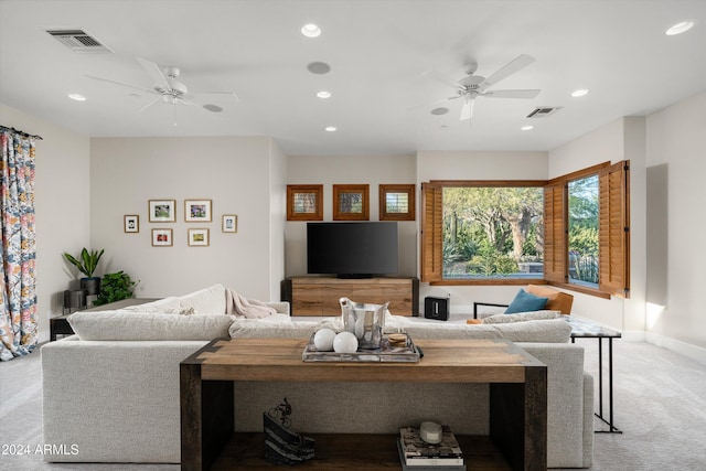 living room with light carpet and ceiling fan