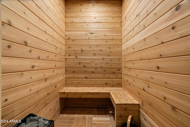 view of sauna featuring wood walls