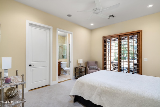 carpeted bedroom featuring ensuite bathroom and ceiling fan