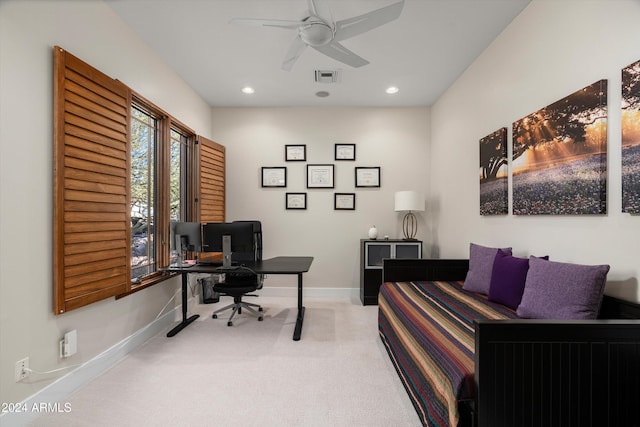 carpeted office featuring ceiling fan