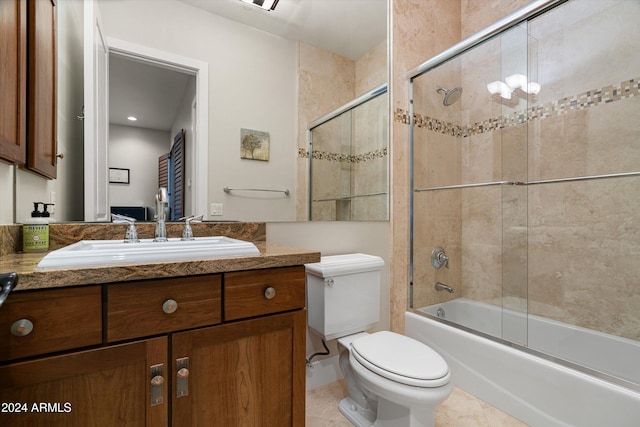 full bathroom featuring vanity, combined bath / shower with glass door, tile patterned flooring, toilet, and a chandelier