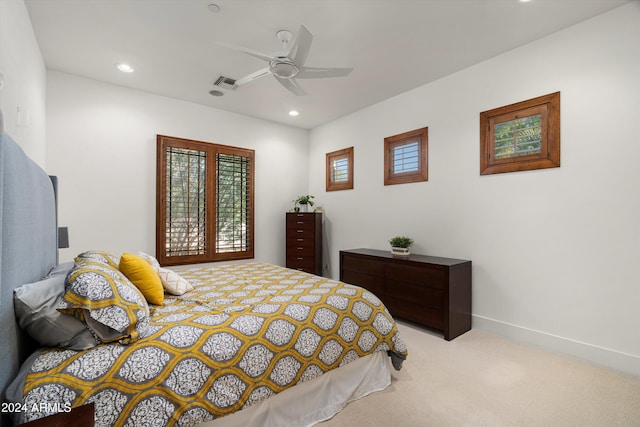 carpeted bedroom with ceiling fan