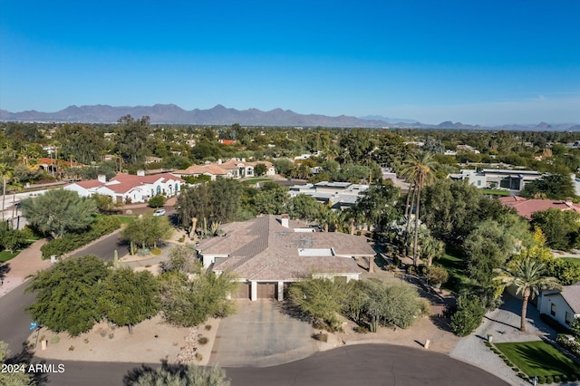 birds eye view of property with a mountain view