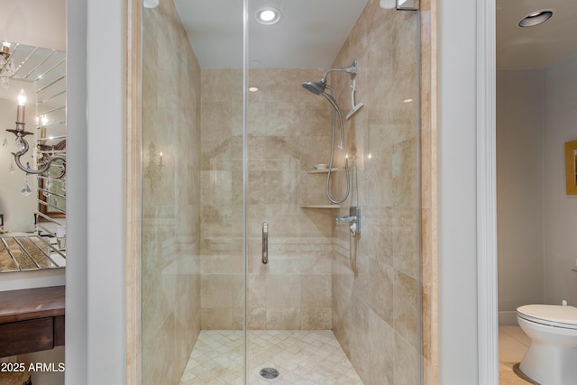 full bathroom featuring a shower stall, toilet, and recessed lighting