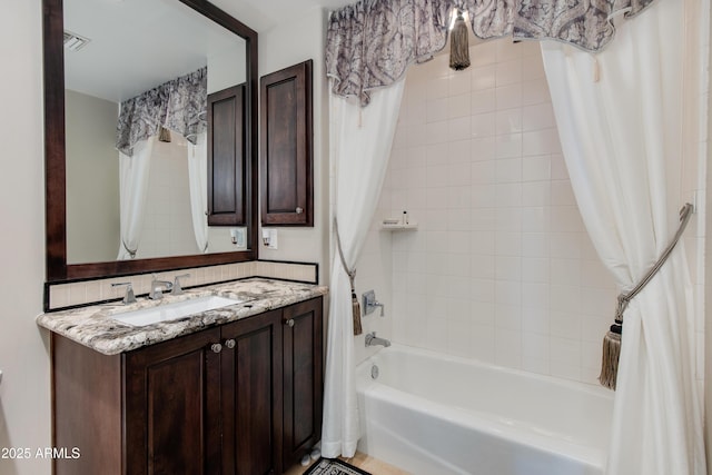 full bath with vanity, shower / bath combination with curtain, and visible vents