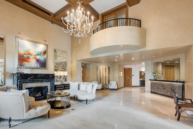 living room featuring beamed ceiling, coffered ceiling, and a premium fireplace