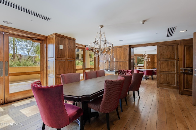 dining area with recessed lighting, visible vents, light wood finished floors, and a chandelier