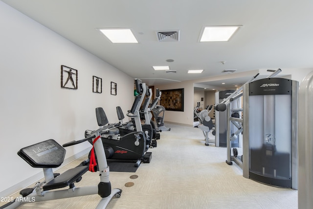 gym with visible vents, carpet floors, and baseboards