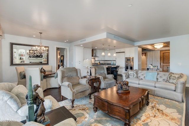 living room featuring light wood-type flooring, visible vents, and recessed lighting