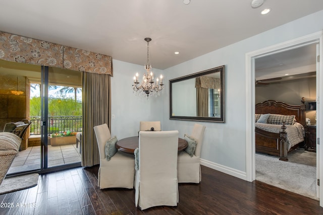 dining room with a notable chandelier, recessed lighting, wood finished floors, and baseboards