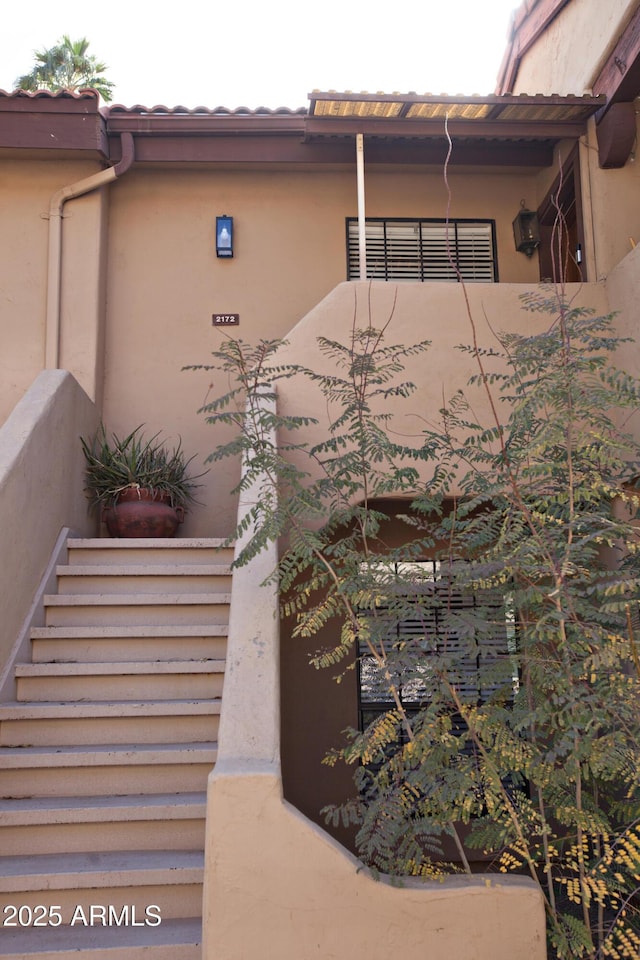 exterior space featuring stucco siding