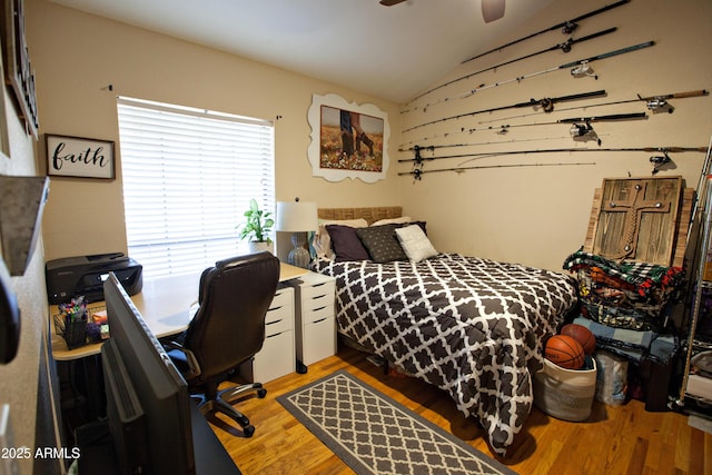 bedroom featuring wood-type flooring and lofted ceiling