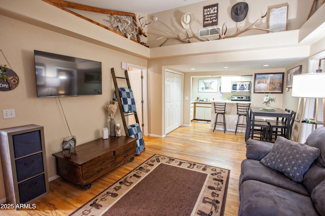 living room with light hardwood / wood-style floors