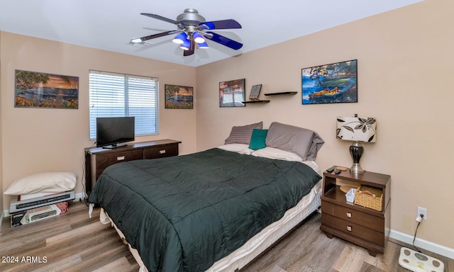 bedroom featuring ceiling fan and light wood-type flooring