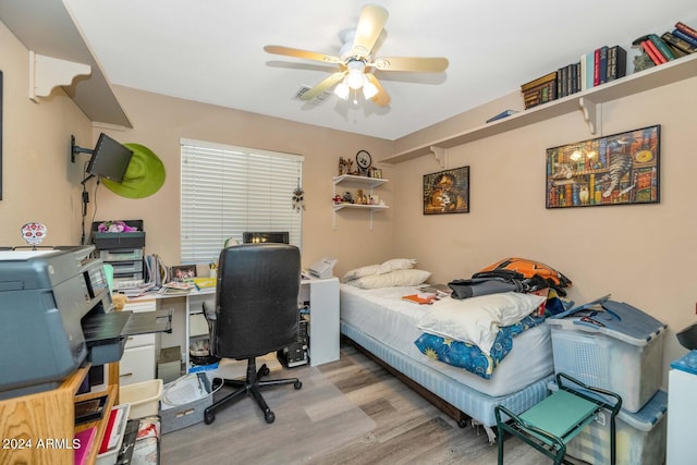 bedroom featuring light hardwood / wood-style flooring and ceiling fan