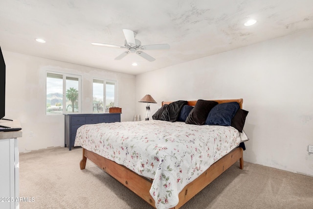 bedroom featuring recessed lighting, light colored carpet, and ceiling fan