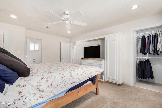 bedroom with ceiling fan, recessed lighting, light colored carpet, visible vents, and a closet