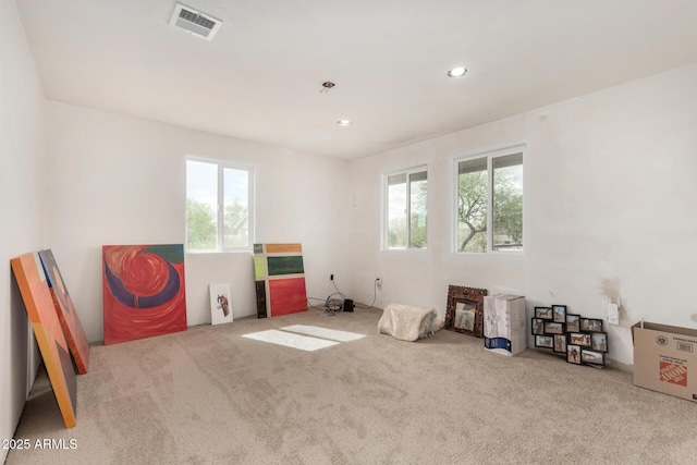 miscellaneous room with recessed lighting, carpet flooring, plenty of natural light, and visible vents