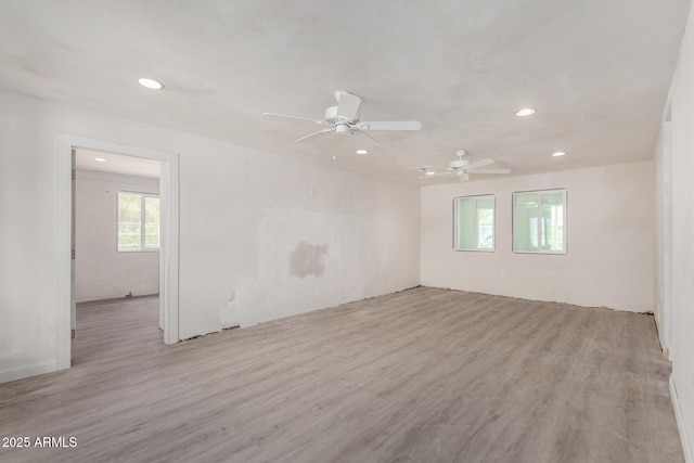 empty room featuring wood finished floors and recessed lighting