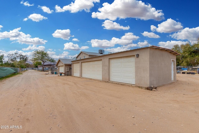 garage with fence