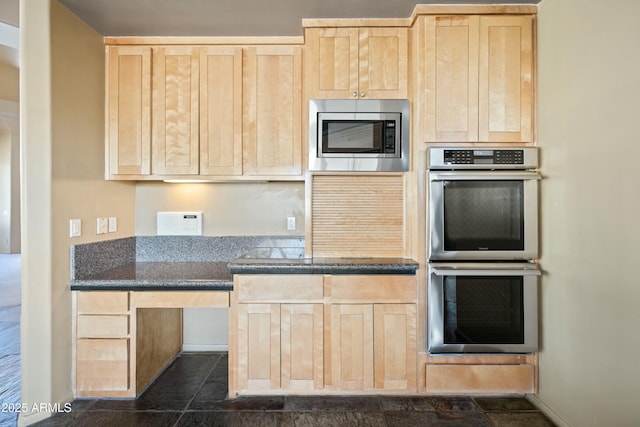 kitchen with stainless steel appliances and light brown cabinets