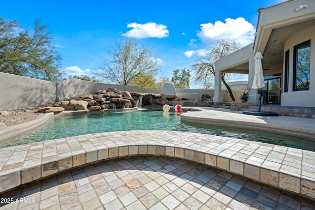 view of pool featuring pool water feature