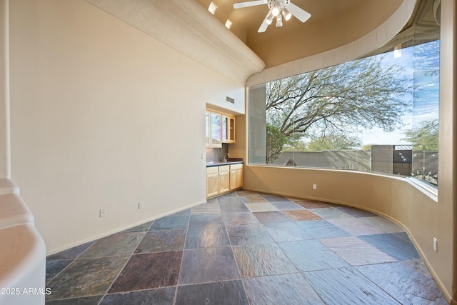 interior space featuring ceiling fan