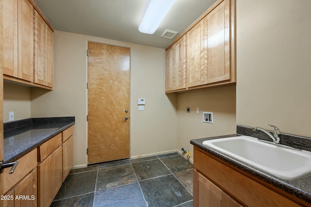 washroom with cabinets, gas dryer hookup, sink, and washer hookup