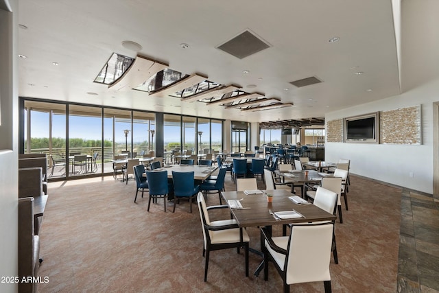 dining room featuring a wall of windows