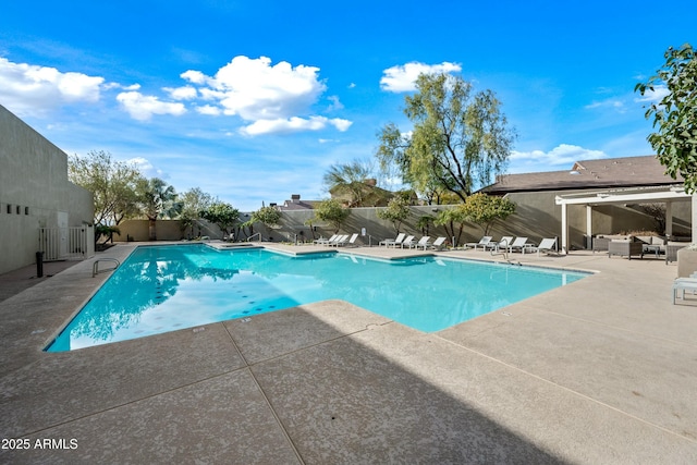 view of swimming pool with a patio