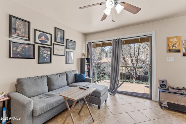 living room featuring light tile patterned floors and ceiling fan