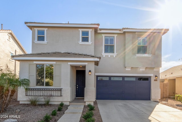 view of front of property with a garage