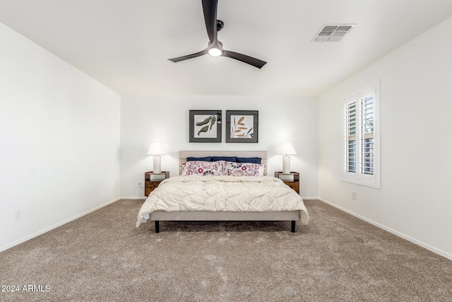 bedroom featuring ceiling fan and carpet