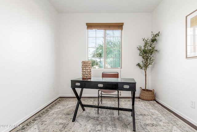 office with wood-type flooring