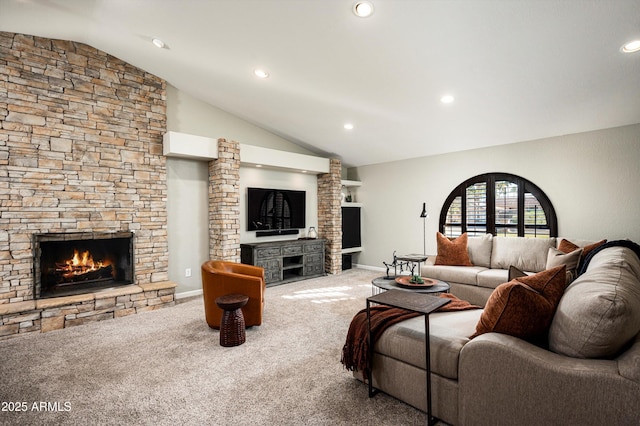 carpeted living room with lofted ceiling and a fireplace