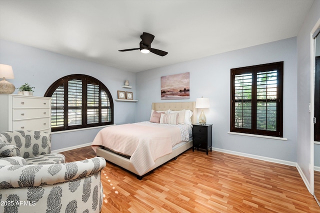 bedroom with ceiling fan and light hardwood / wood-style flooring