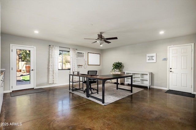 dining area featuring ceiling fan and a wall unit AC