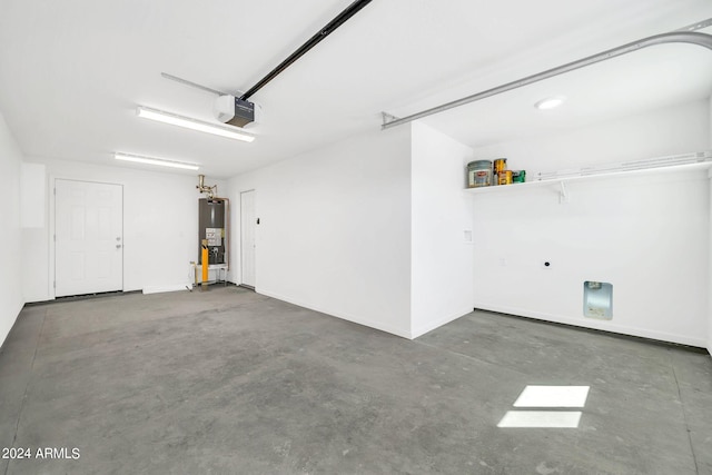 garage featuring water heater and a garage door opener