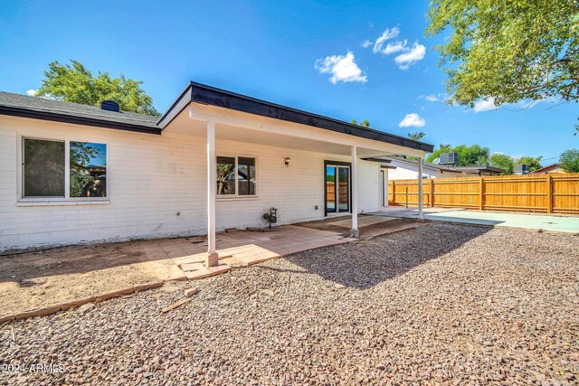 rear view of property featuring a patio