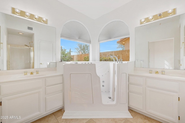 bathroom with vanity, independent shower and bath, and tile patterned floors