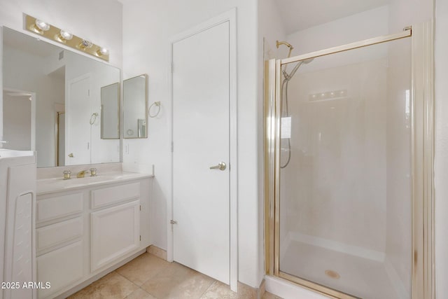 bathroom featuring tile patterned floors, vanity, and an enclosed shower