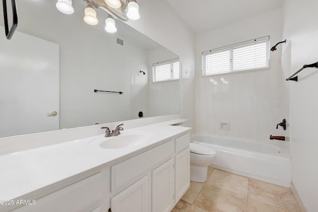 full bathroom featuring toilet, tile patterned flooring, washtub / shower combination, and vanity