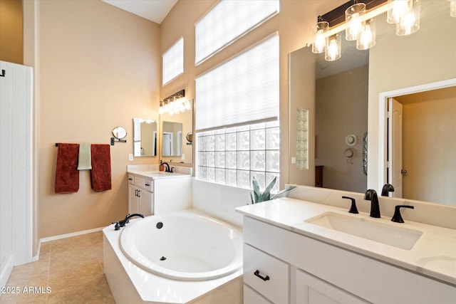 bathroom featuring an inviting chandelier, a relaxing tiled tub, tile patterned flooring, and a wealth of natural light