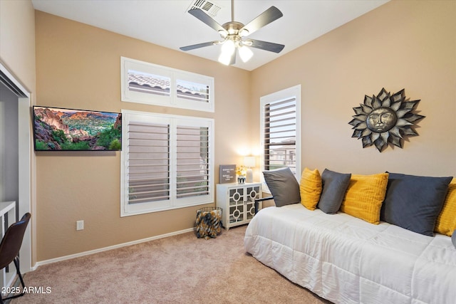 bedroom featuring light carpet and ceiling fan