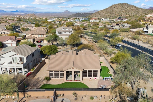 birds eye view of property with a mountain view