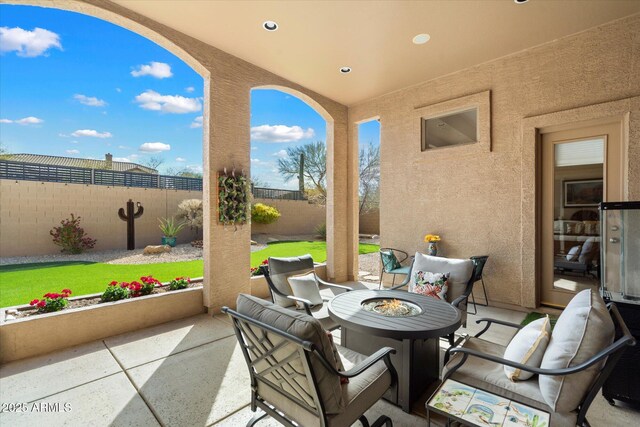 view of patio featuring a fire pit