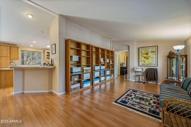 2041 W Hacienda Way, Show Low, AZ 85901 - living room featuring light wood finished floors, baseboards, arched walkways, and recessed lighting